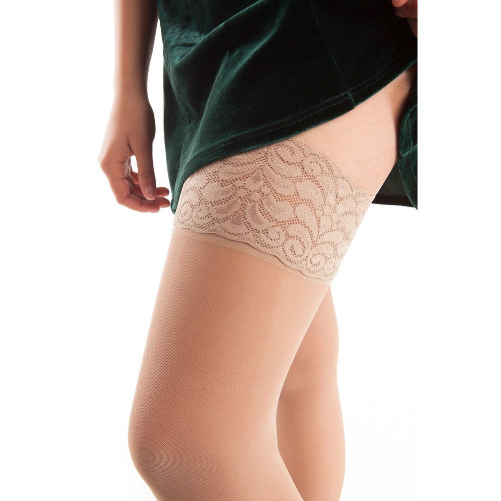 Close-up of Gabrialla compression thigh highs with elegant lace tops